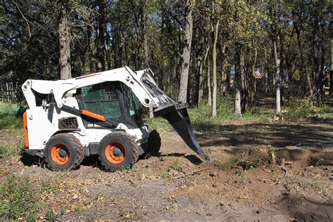 diggingup stump with a skid steer attachments|best practices for stump removal.